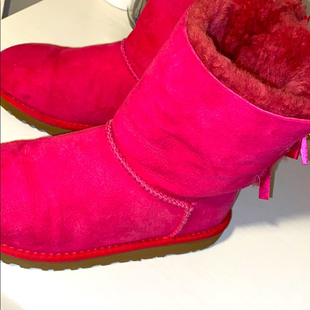 Pink UGG boots with bows